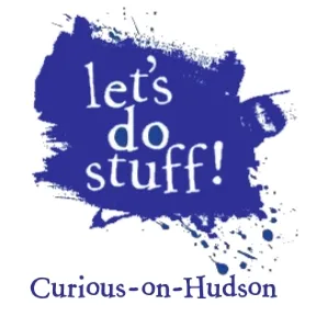 The Curious-on-Hudson logo: 'let's do stuff!' in white lettering on an enthusiastic splat of blue paint.